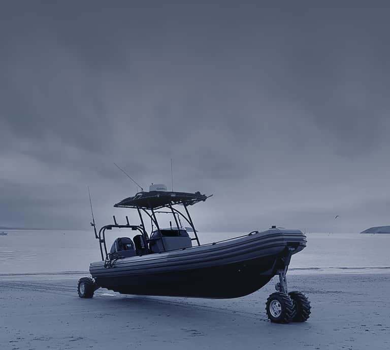 boat parked on the sand
